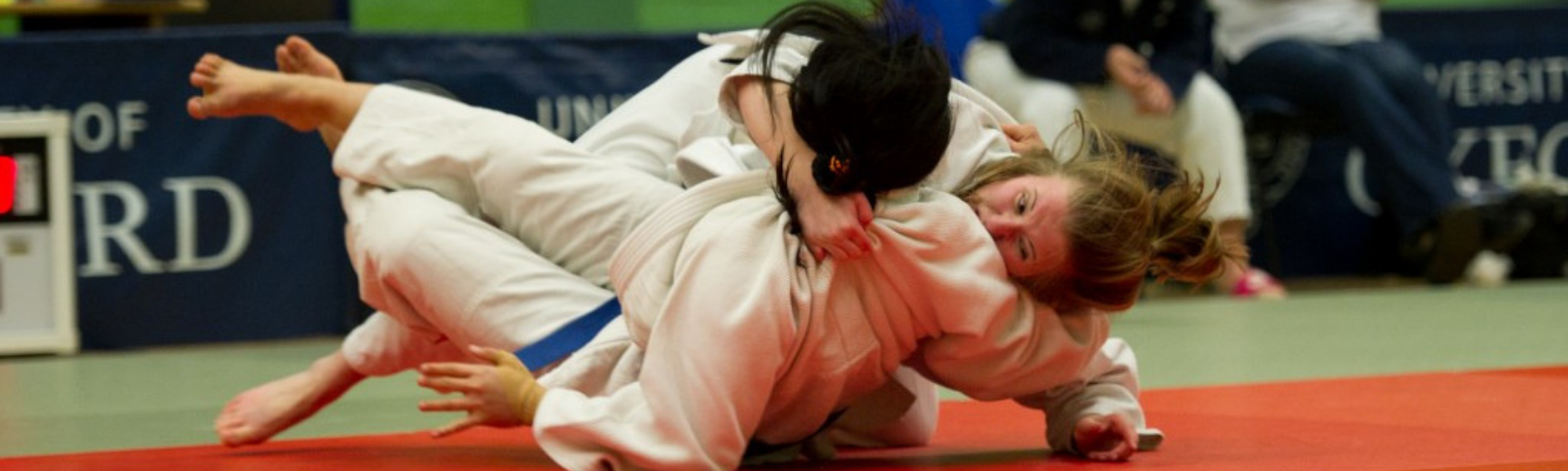 Two women on the floor during the Judo Varsity match between Oxford and Cambridge