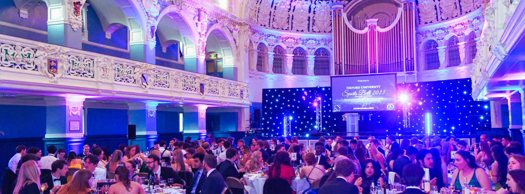 Image of students seated at Sports Ball in Oxford Town Hall