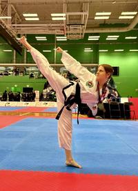 Eleanor Warrington doing a Taewondo kick